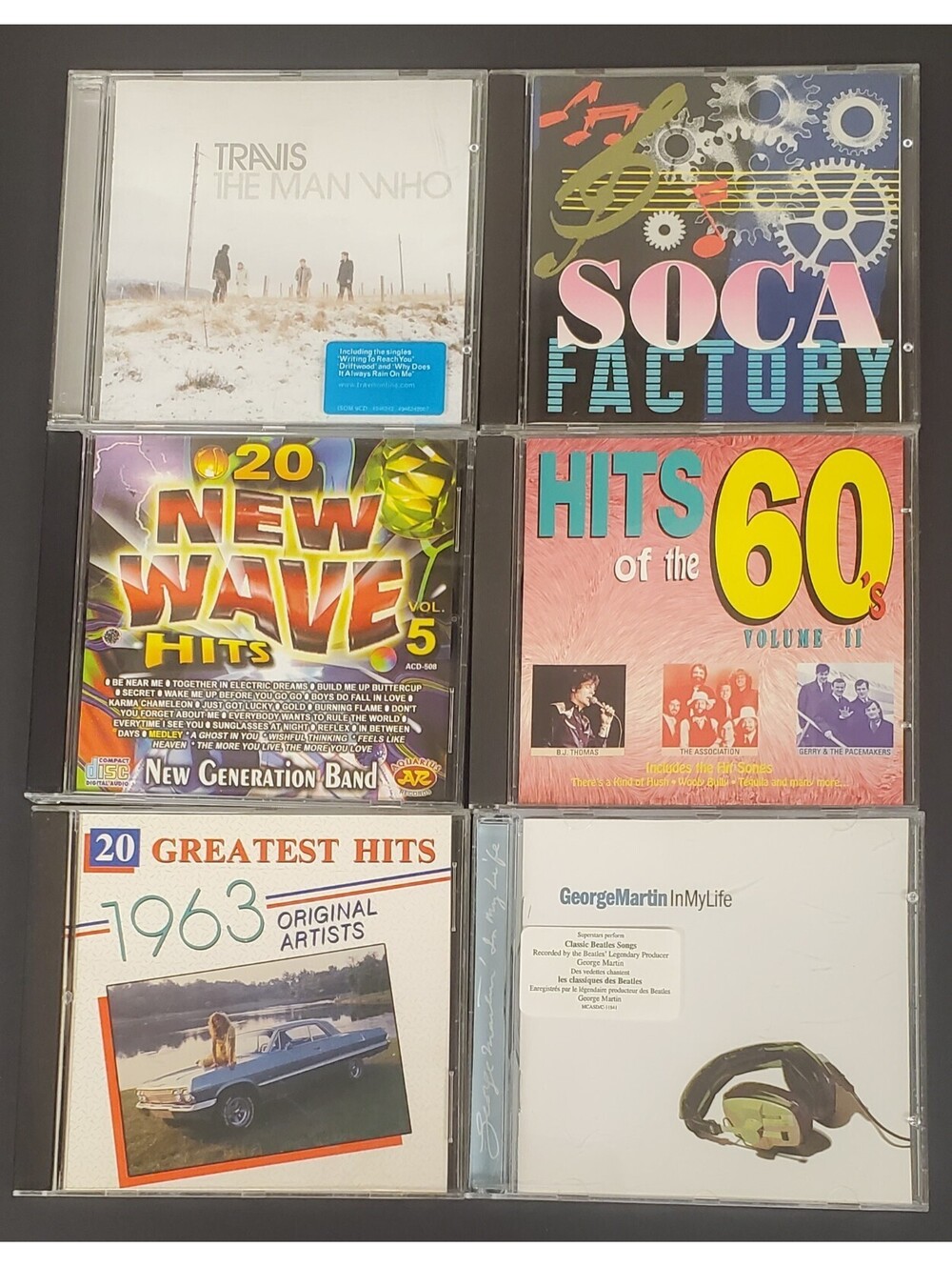 6 Music CDs - Travis, Soca Factory, New Wave Hits Vol. 5, Hits of the 60s+ GC